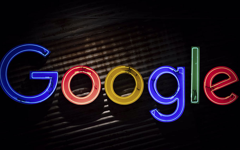 photo of a neon sign saying google